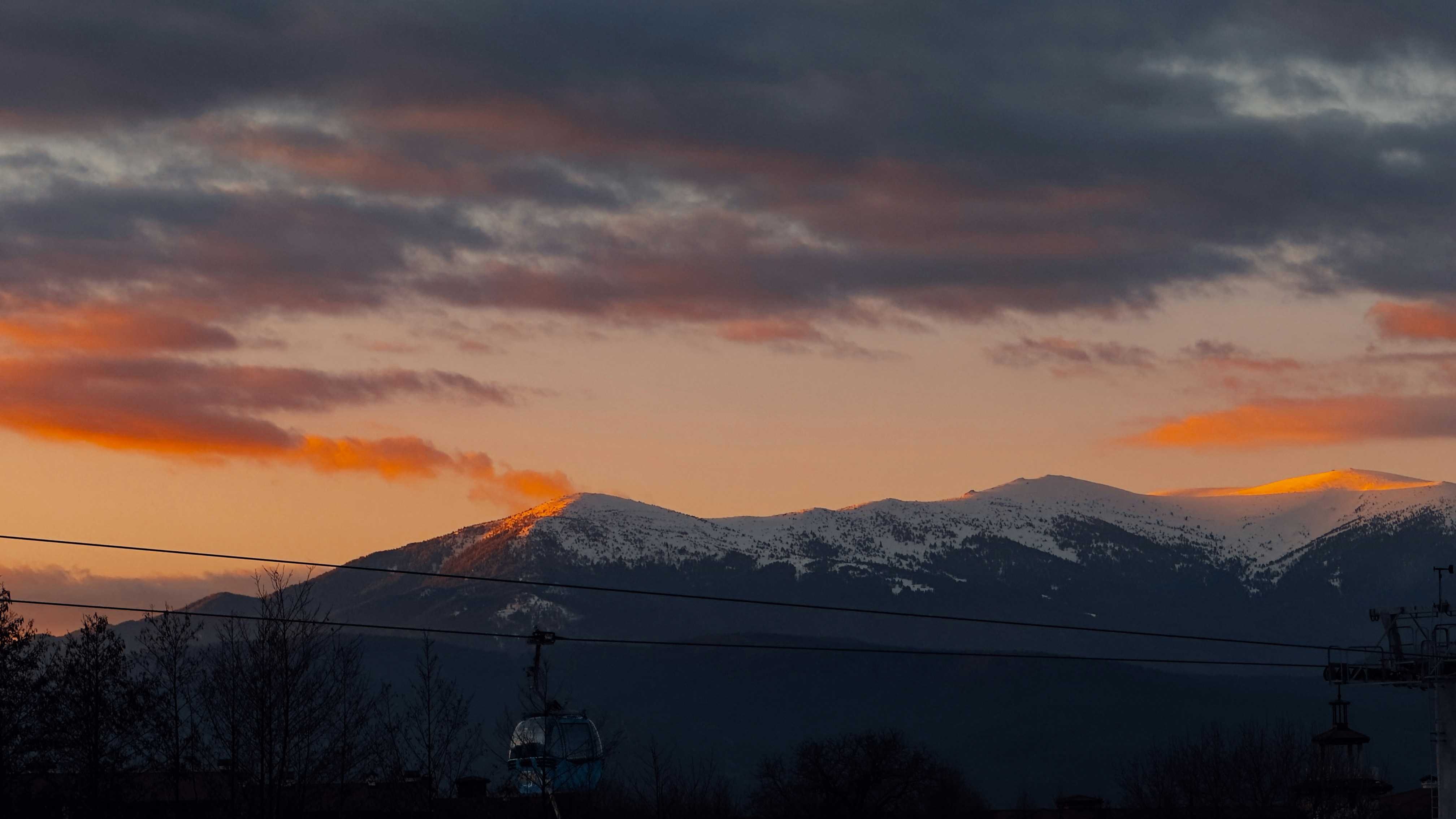 a view of a mountain range at sunset, 