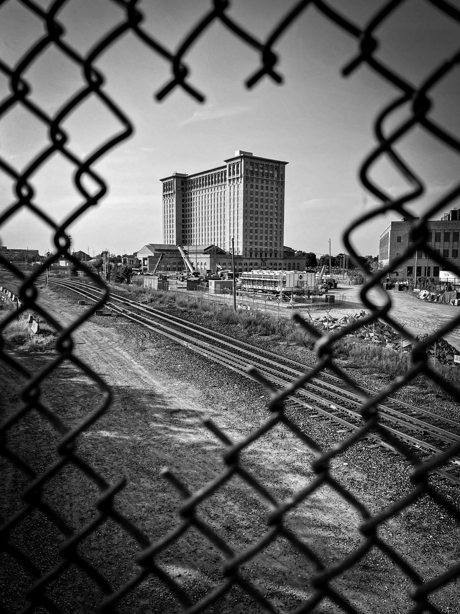 a black and white photo of a train track