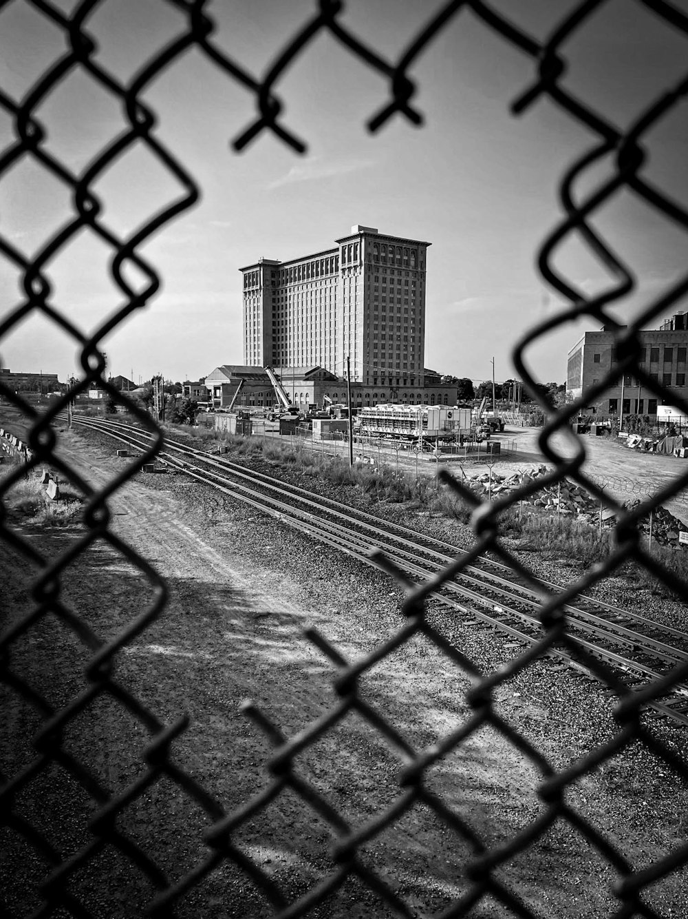 a black and white photo of a train track