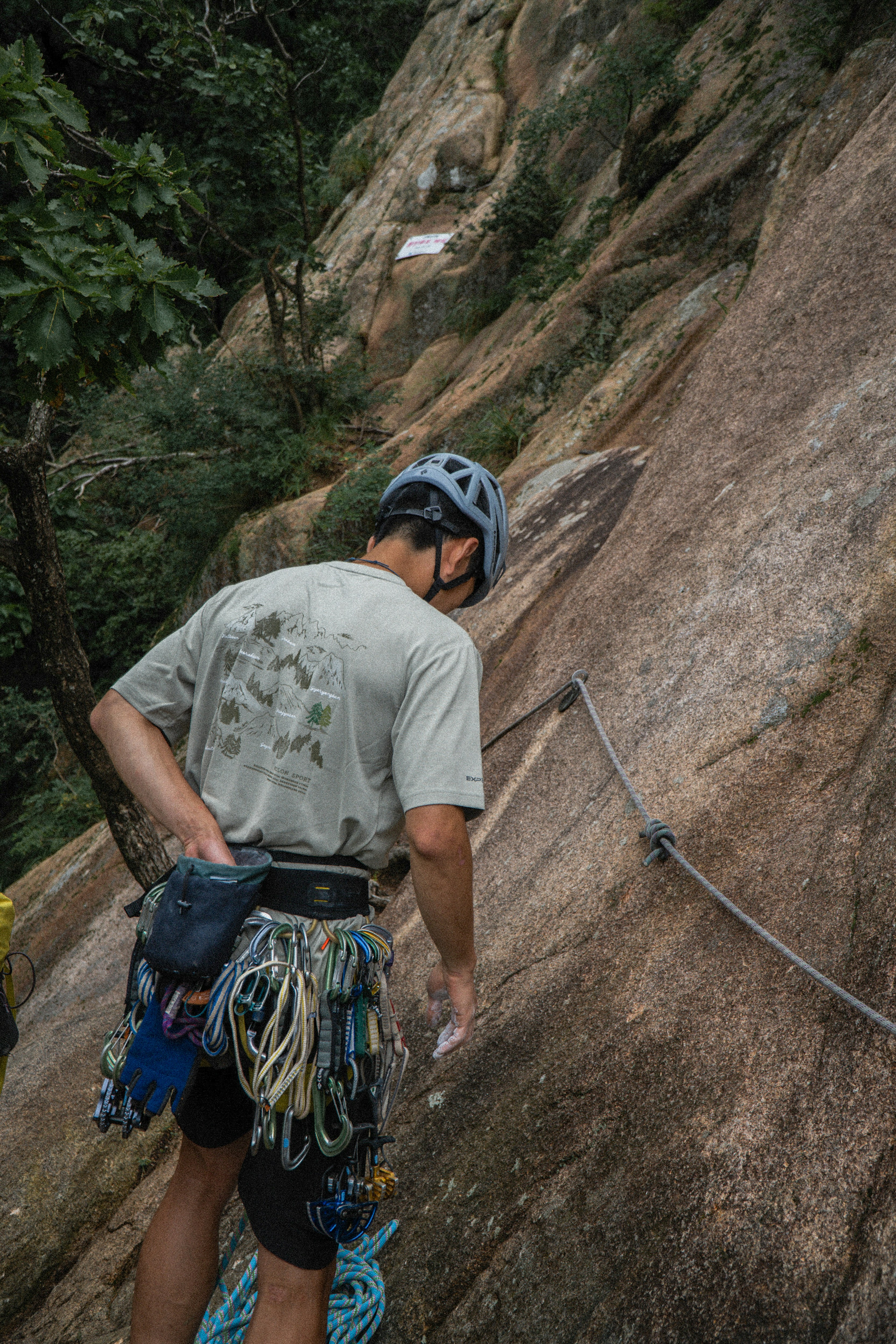 A climber on the side of a mountain