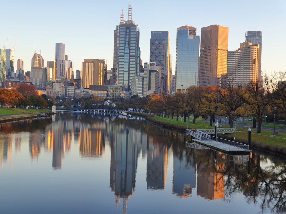 a body of water with a city in the background