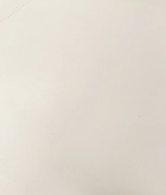 A smooth off-white surface with a subtle matte texture