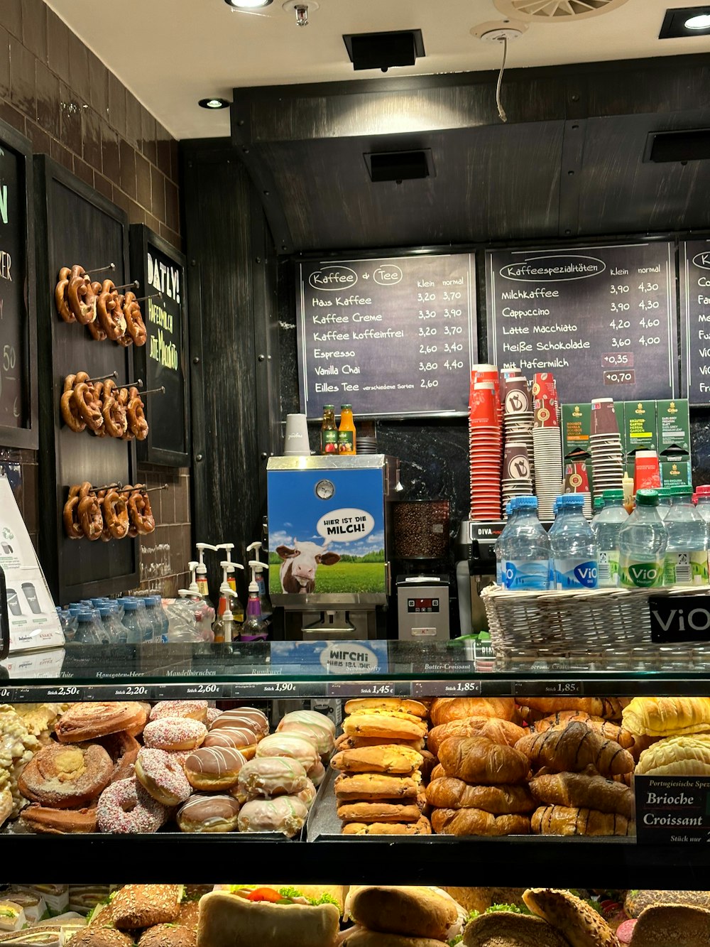 a display case filled with lots of different types of donuts