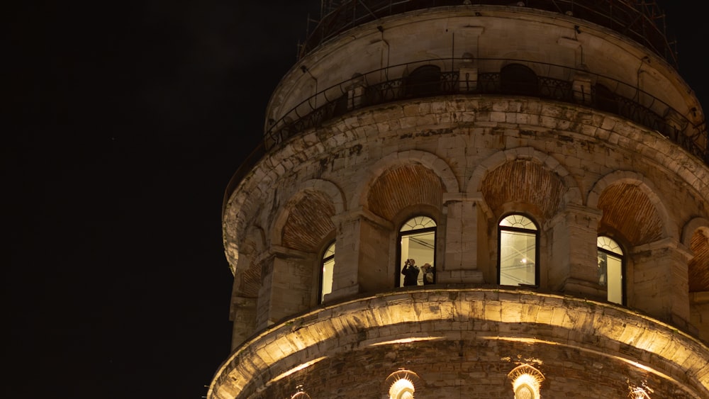 a very tall tower with a clock on it's side