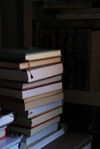 a stack of books sitting on top of a table