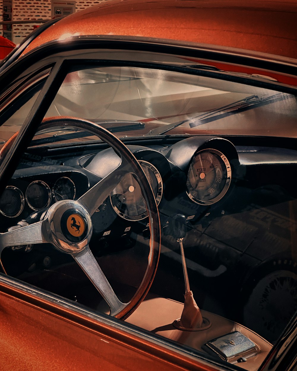 the interior of a car with a steering wheel and dashboard