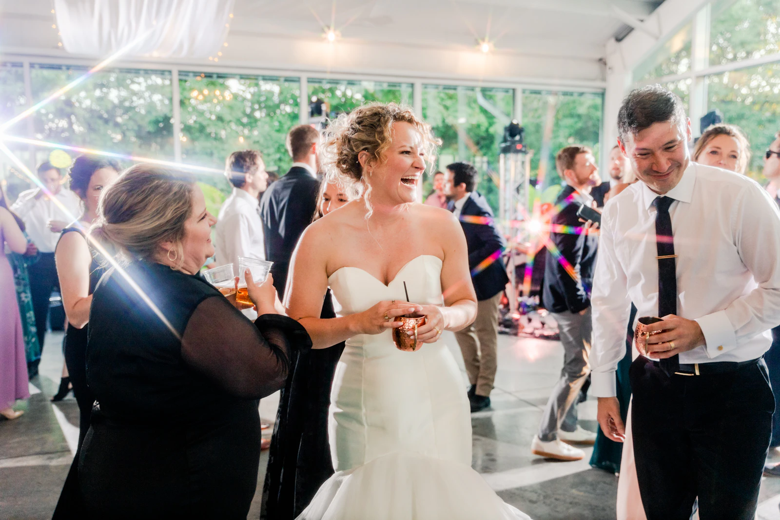 Bride and groom laughing together at their wedding reception