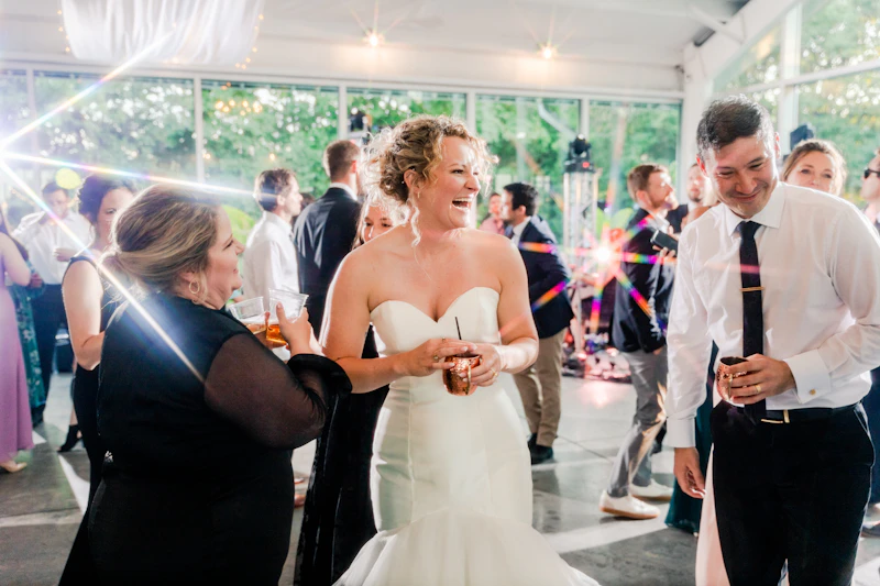 Couple laughing together during their first look