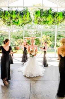a group of women standing around each other