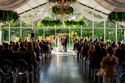 a bride and groom standing at the end of a ceremony