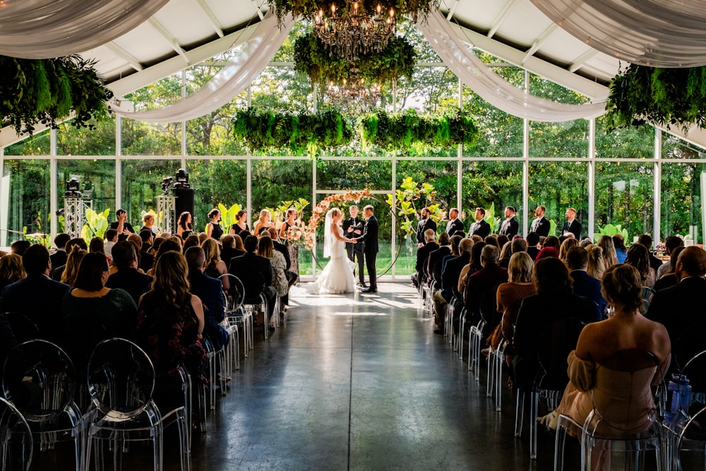 a bride and groom standing at the end of a ceremony