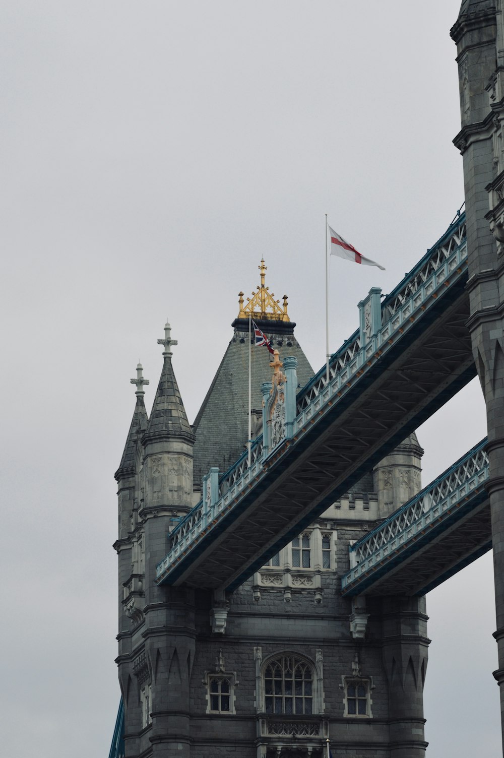 a tall tower with a flag on top of it