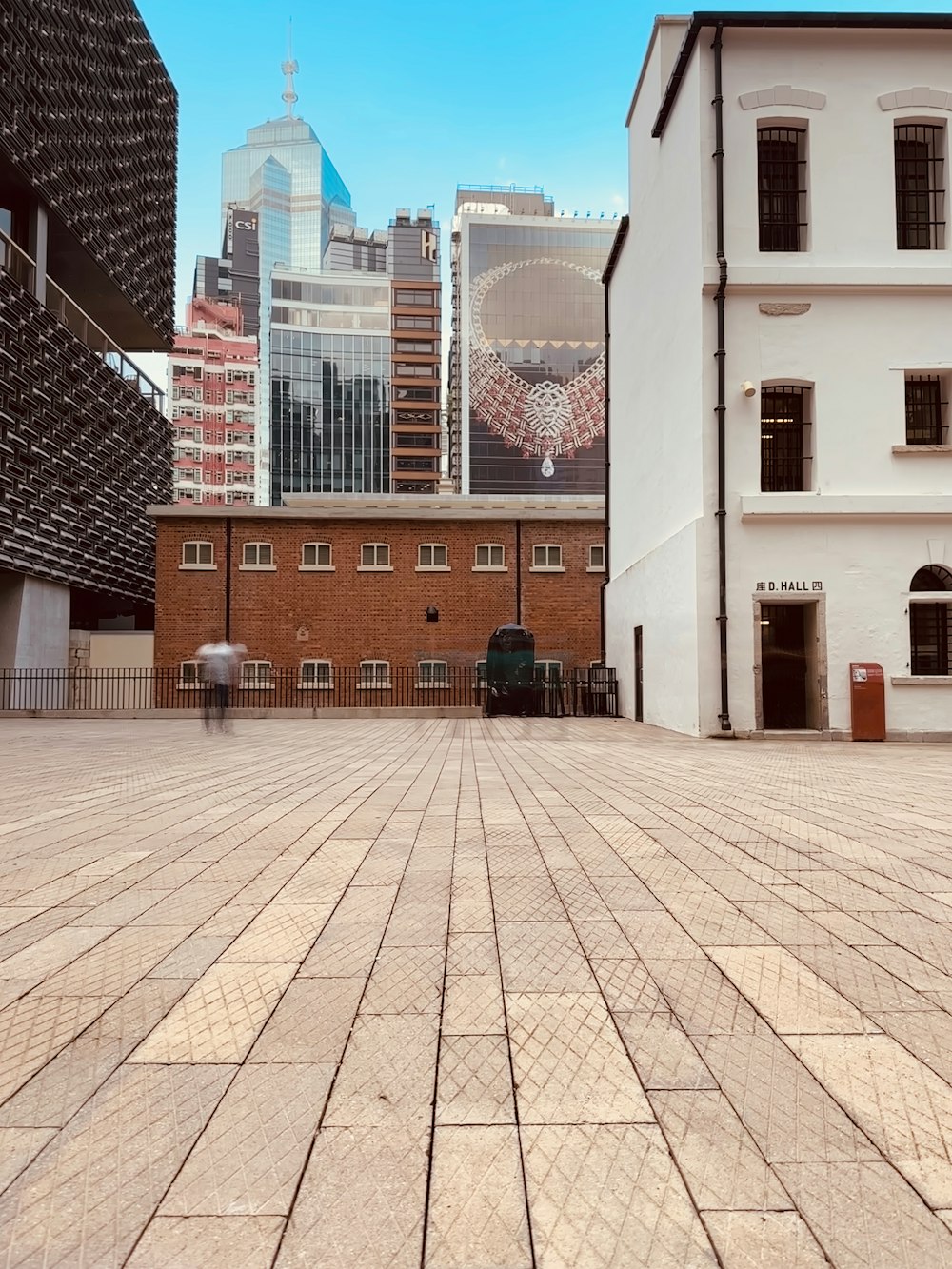 an empty square in front of some buildings