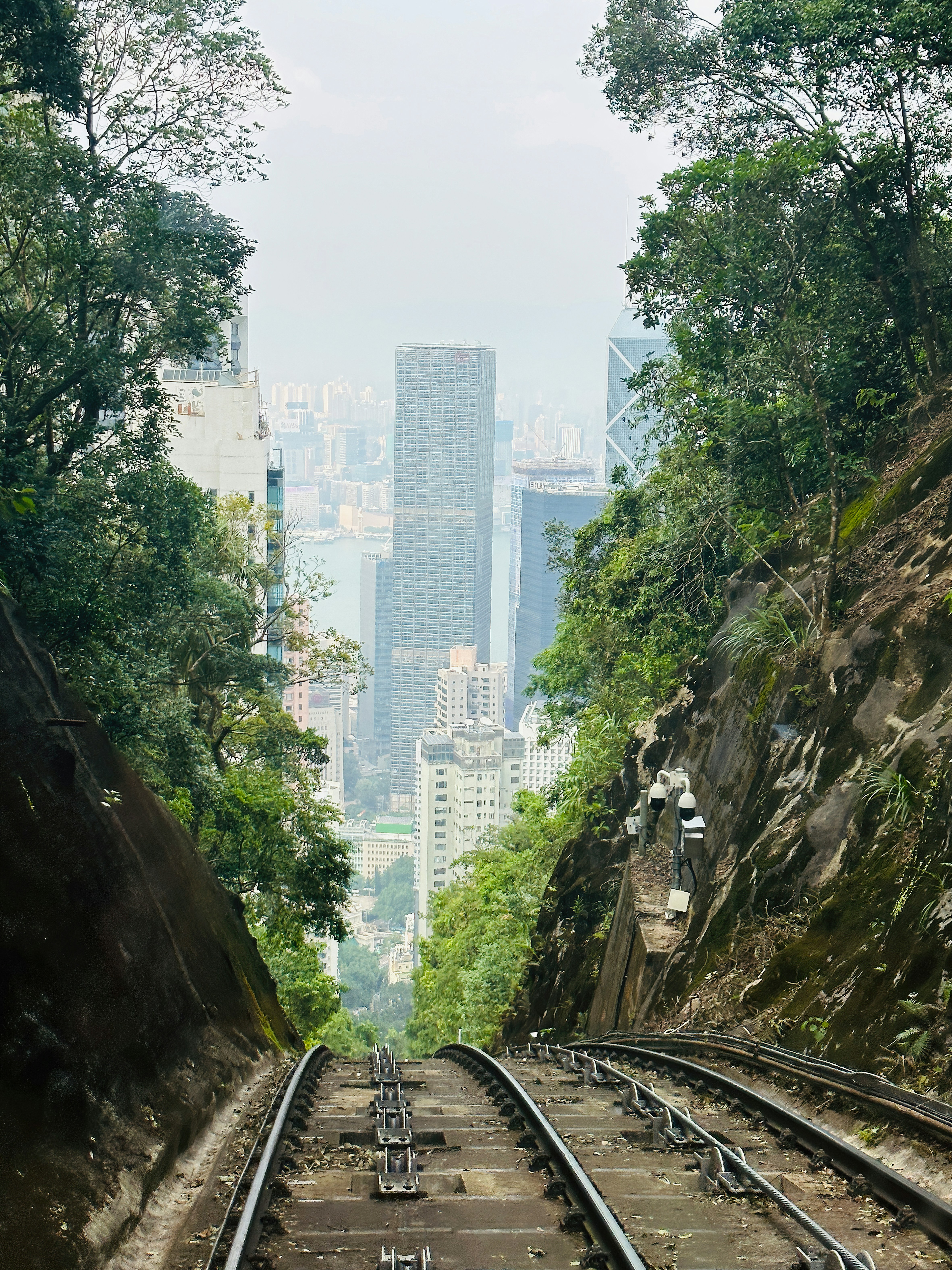 a view of a city from a train track