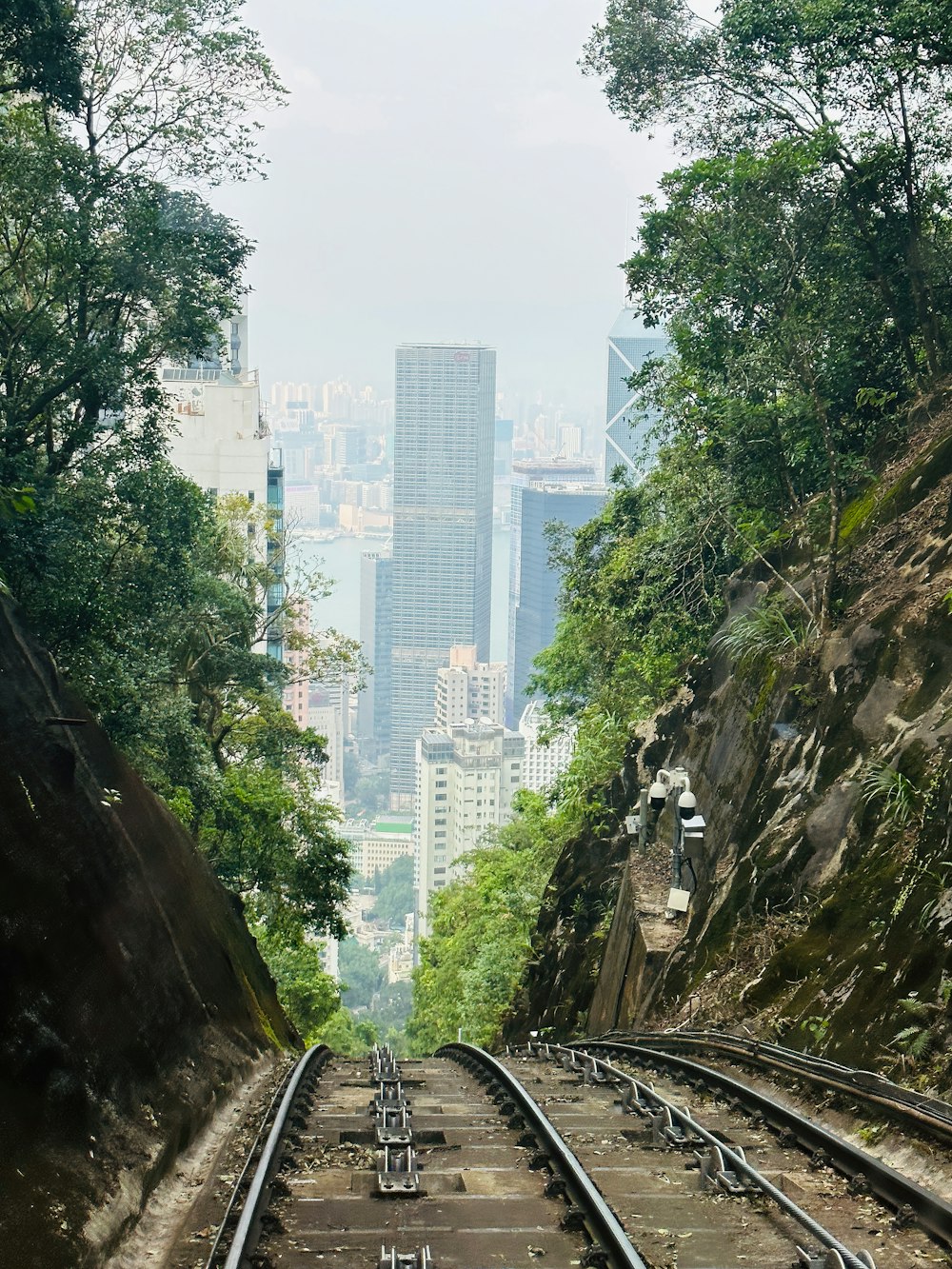 a view of a city from a train track