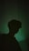 a silhouette of a person in a dark room