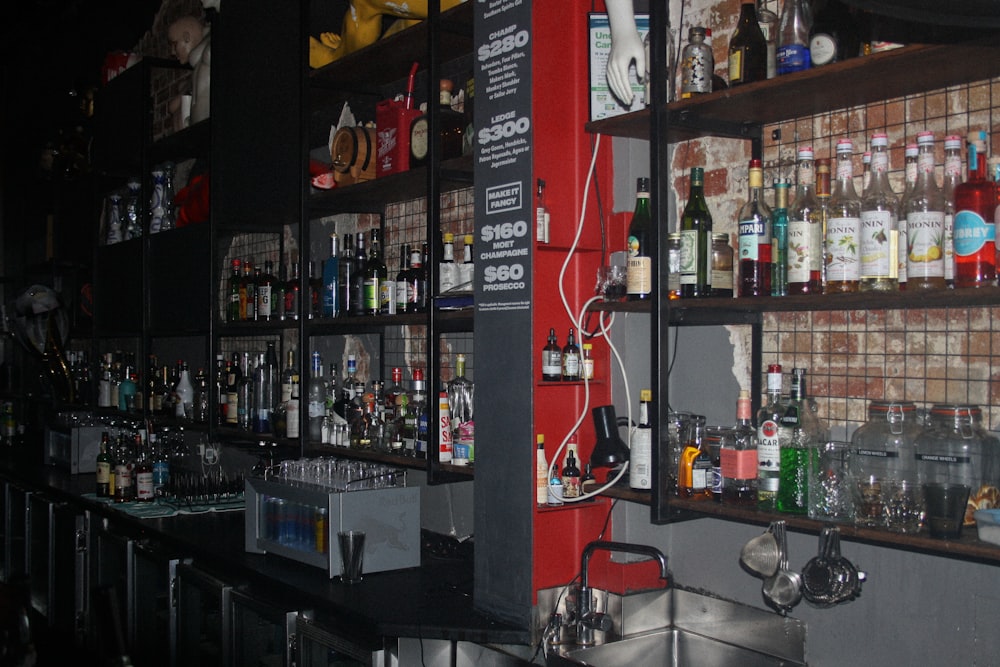 a wall full of liquor bottles in a bar