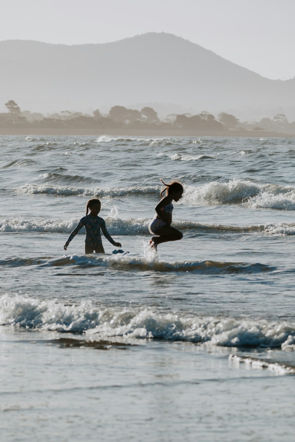 a couple of people that are in the water