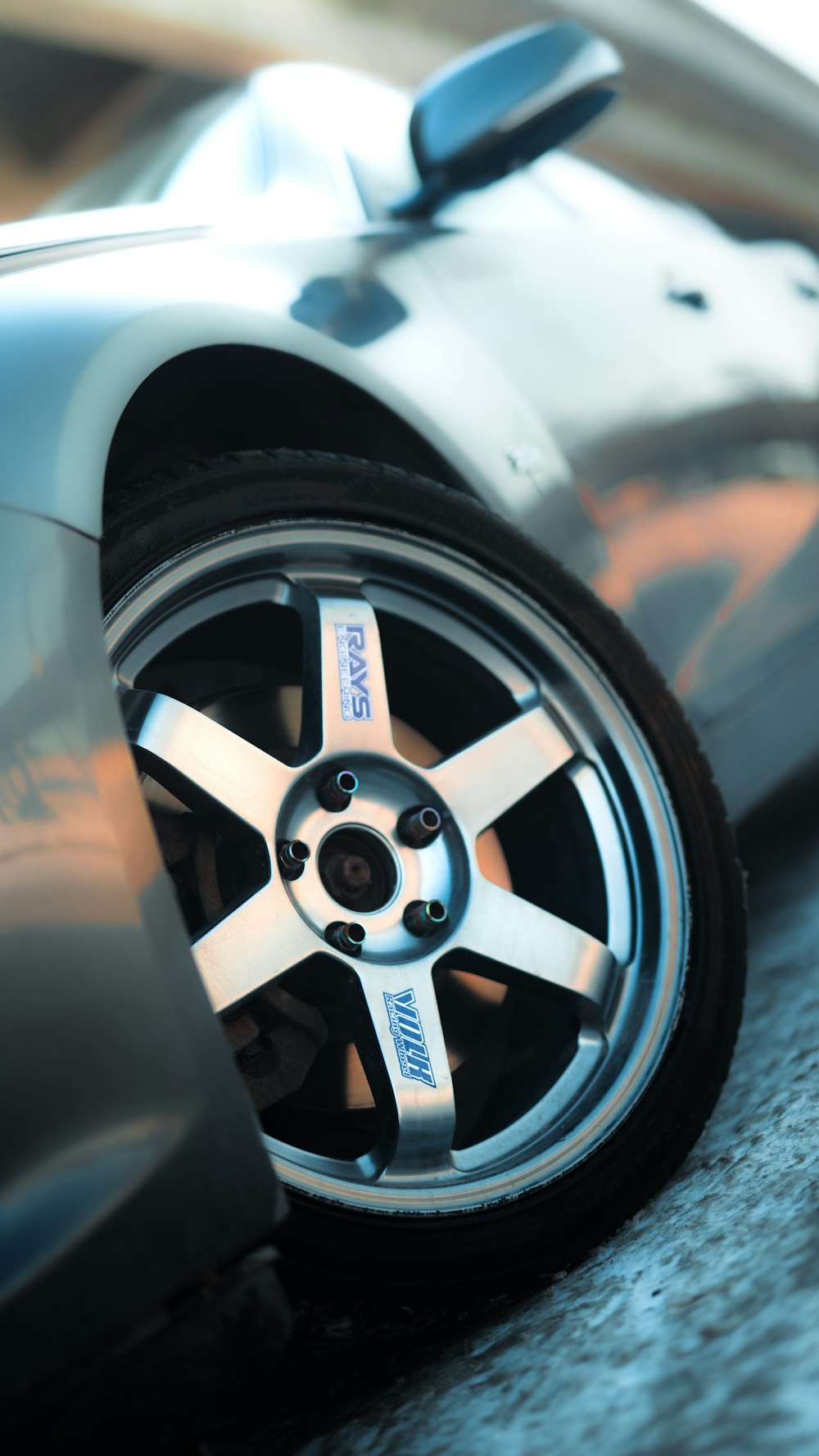 a close up of a car tire on the ground