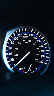 a close up of a speedometer in a car