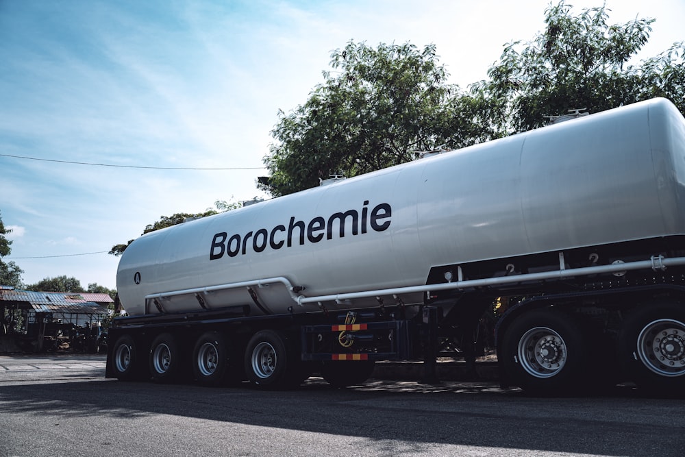 a large tanker truck parked on the side of the road