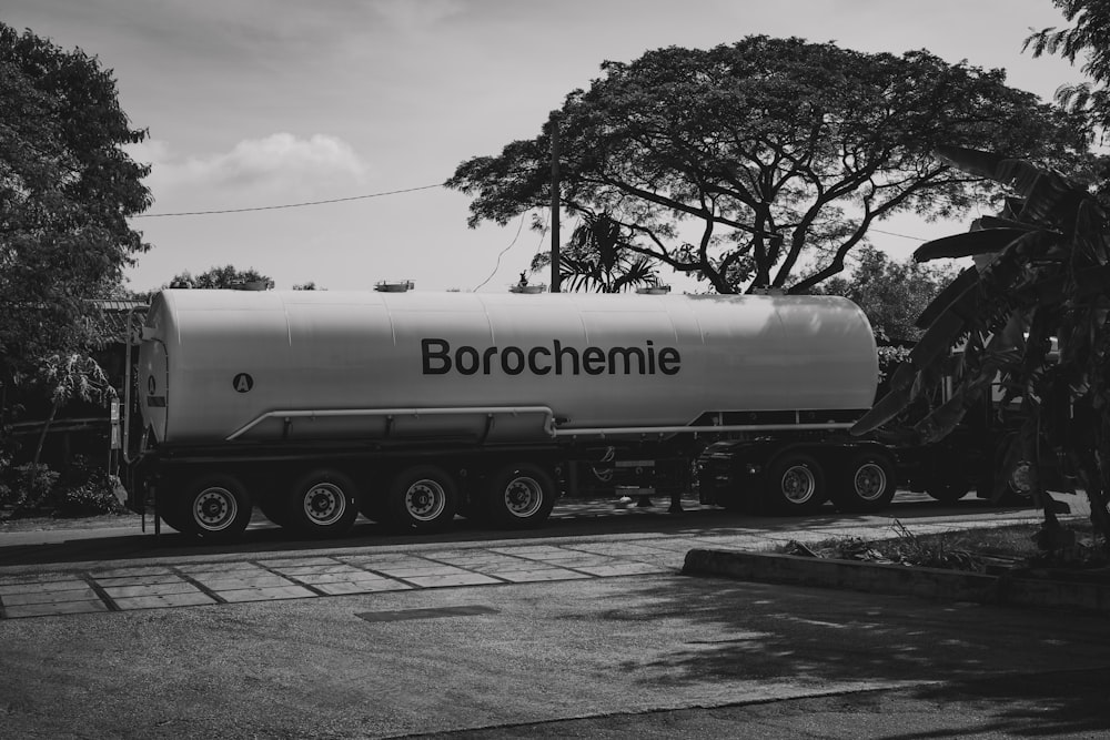 a large tanker truck parked on the side of the road