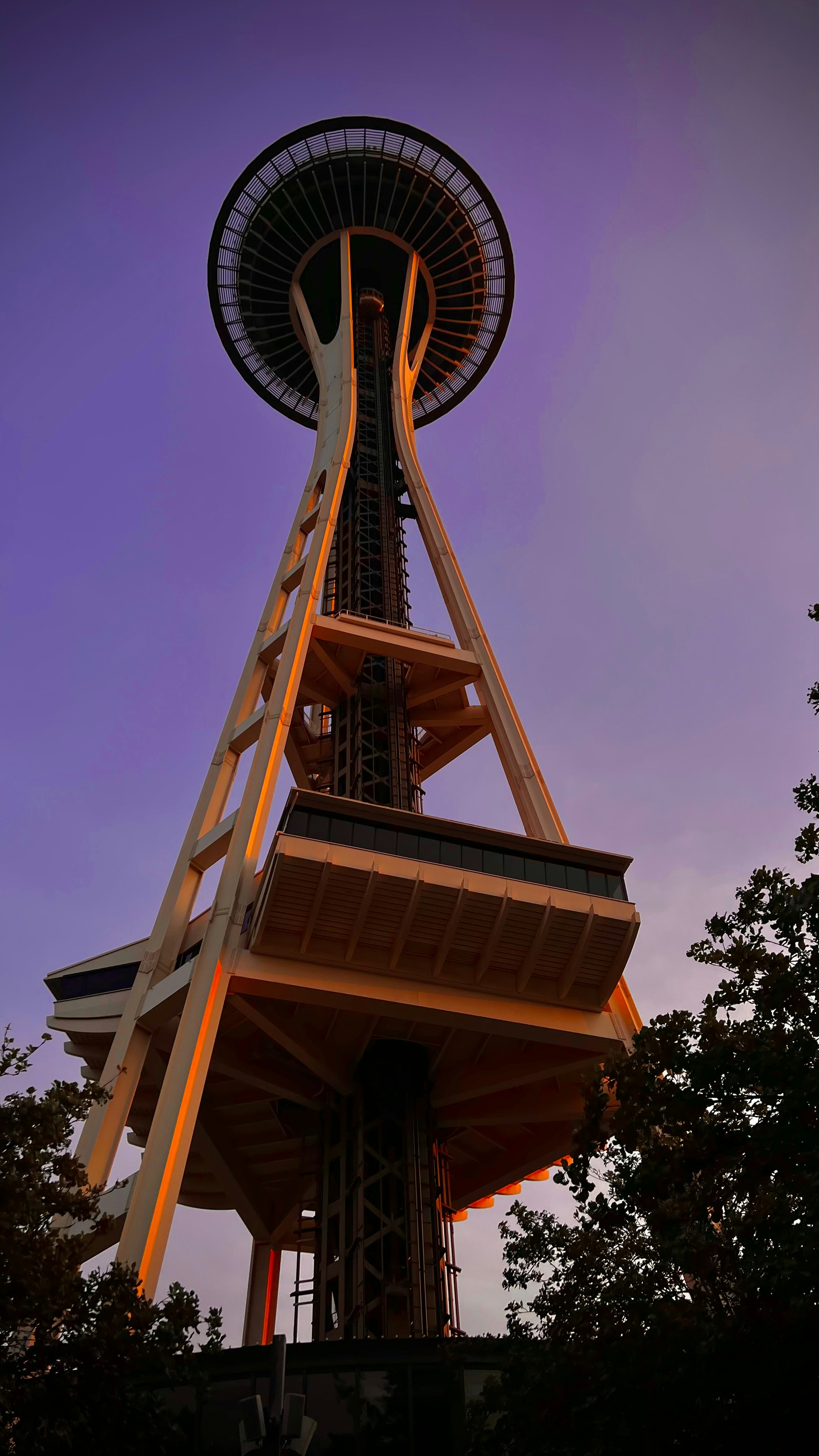 a tall tower with a spiral staircase going up it's side