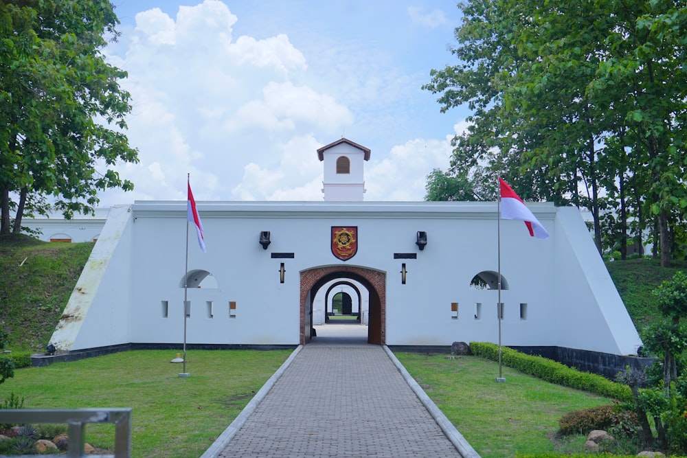 a white building with a clock tower on top of it