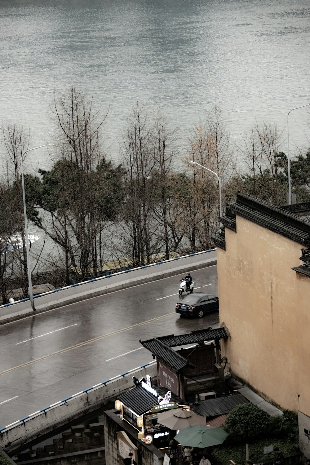 a view of a street and a body of water