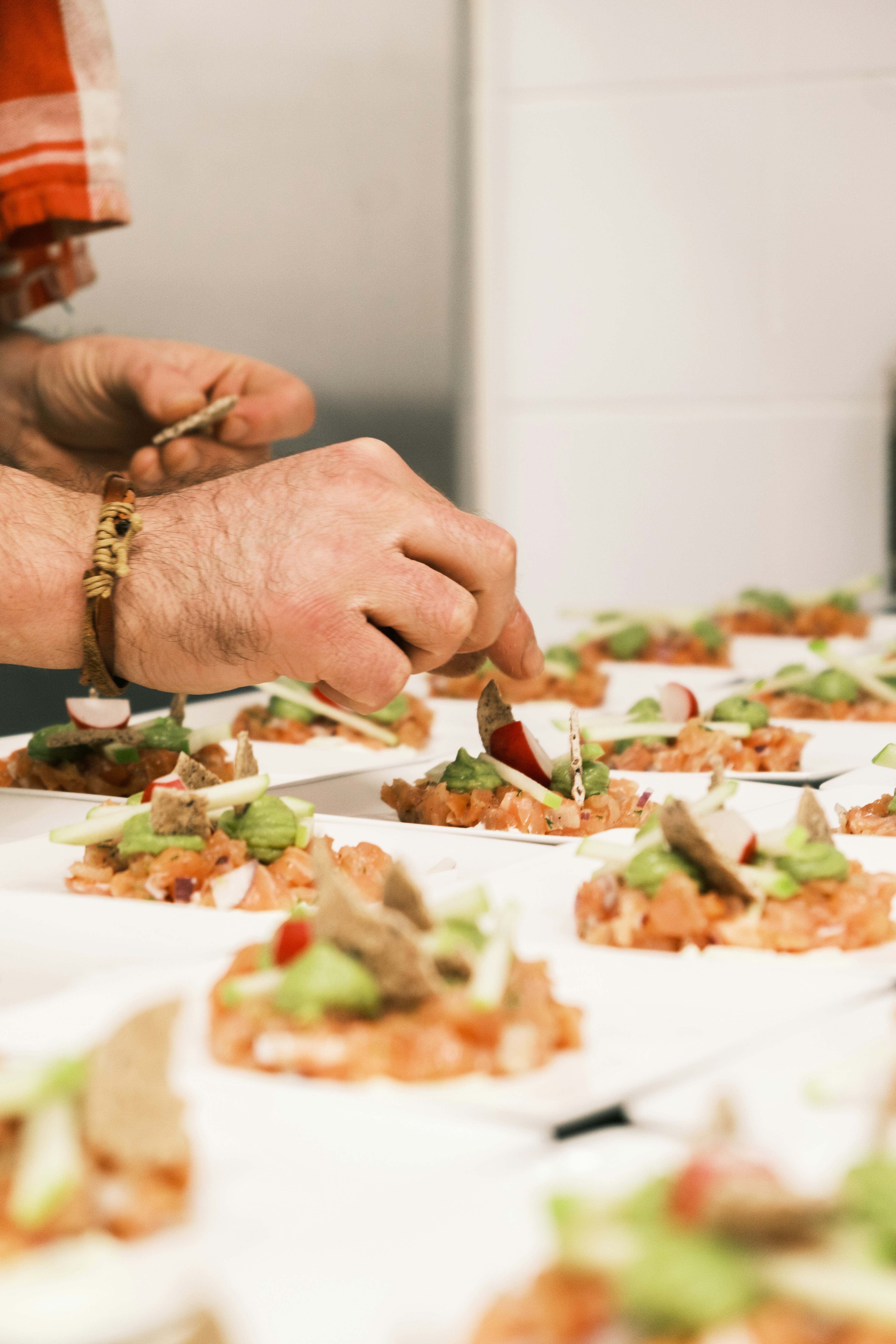 a person cutting food with a knife on a table