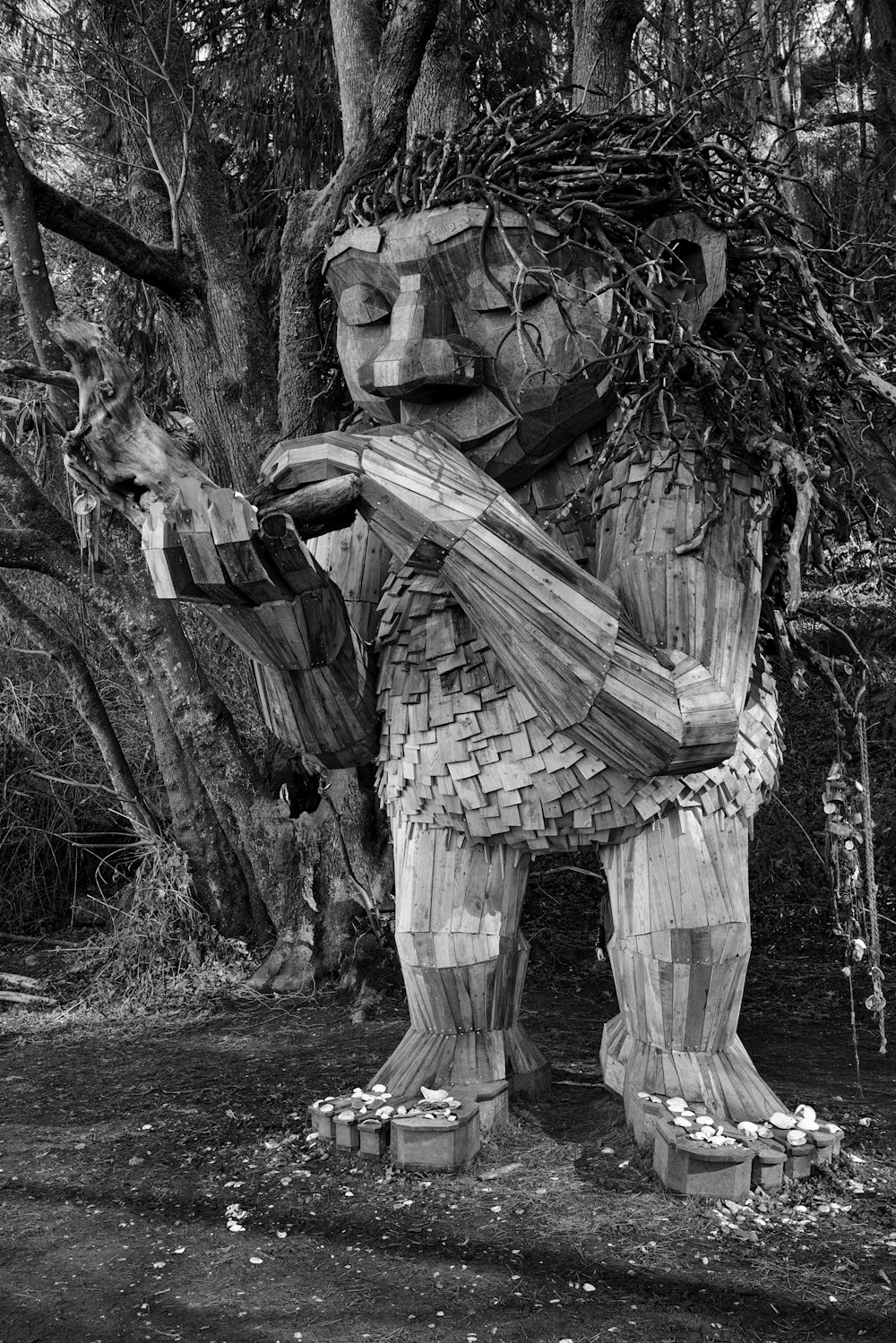 a wooden statue of a man holding a guitar