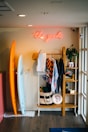a surfboard and a surfboard rack in a room