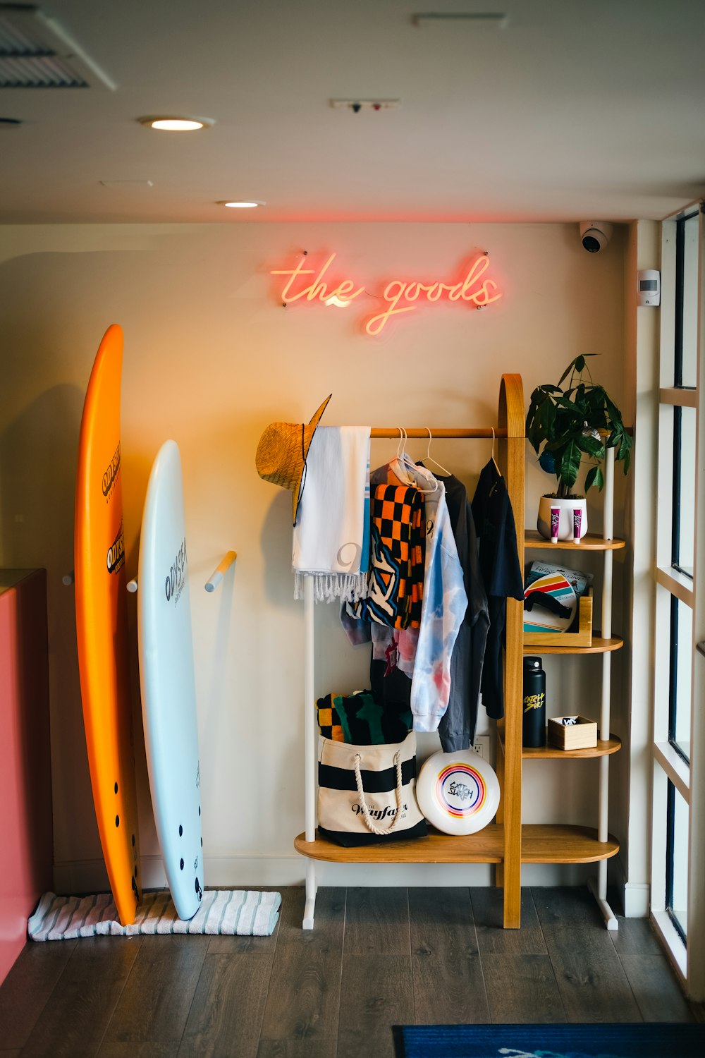 a surfboard and a surfboard rack in a room