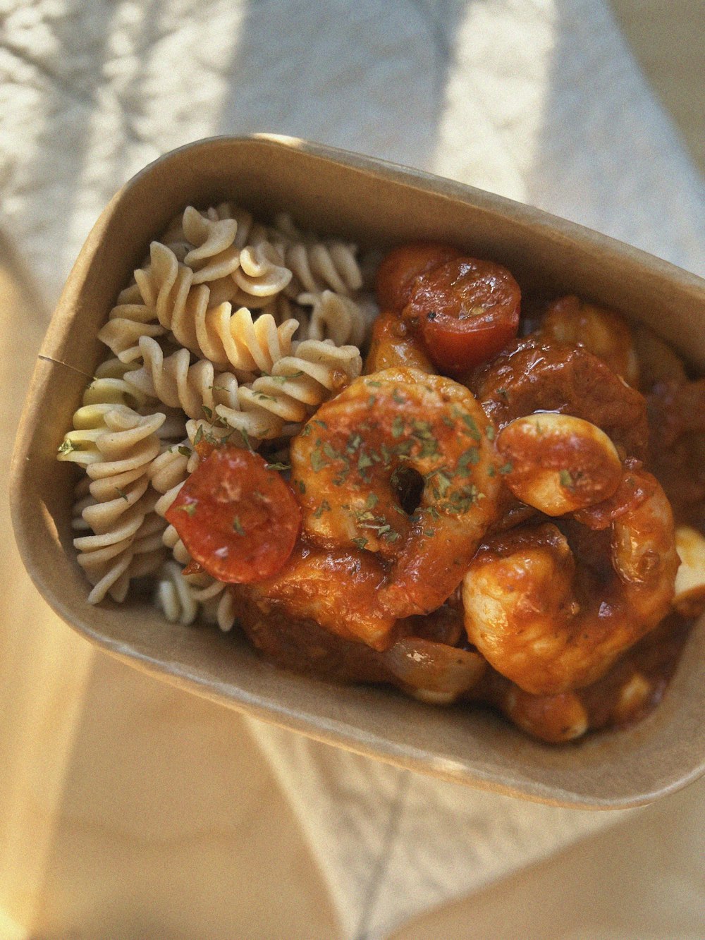 a close up of a bowl of food with pasta