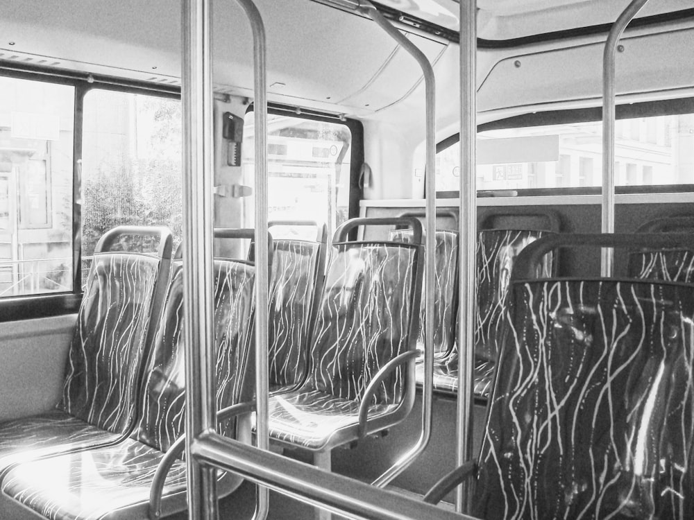 a black and white photo of the inside of a bus