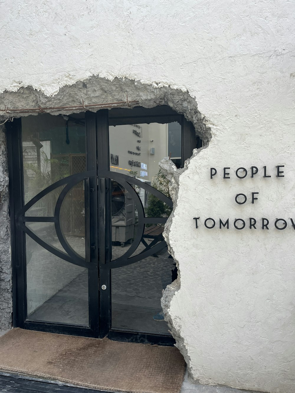 a building with a hole in the side of it that says people of tomorrow