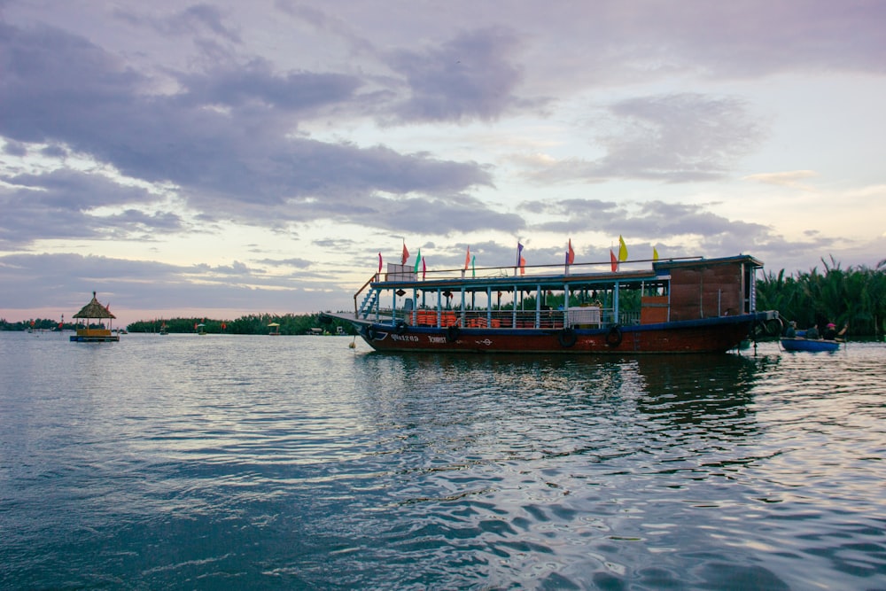 a boat is on the water with a sky background