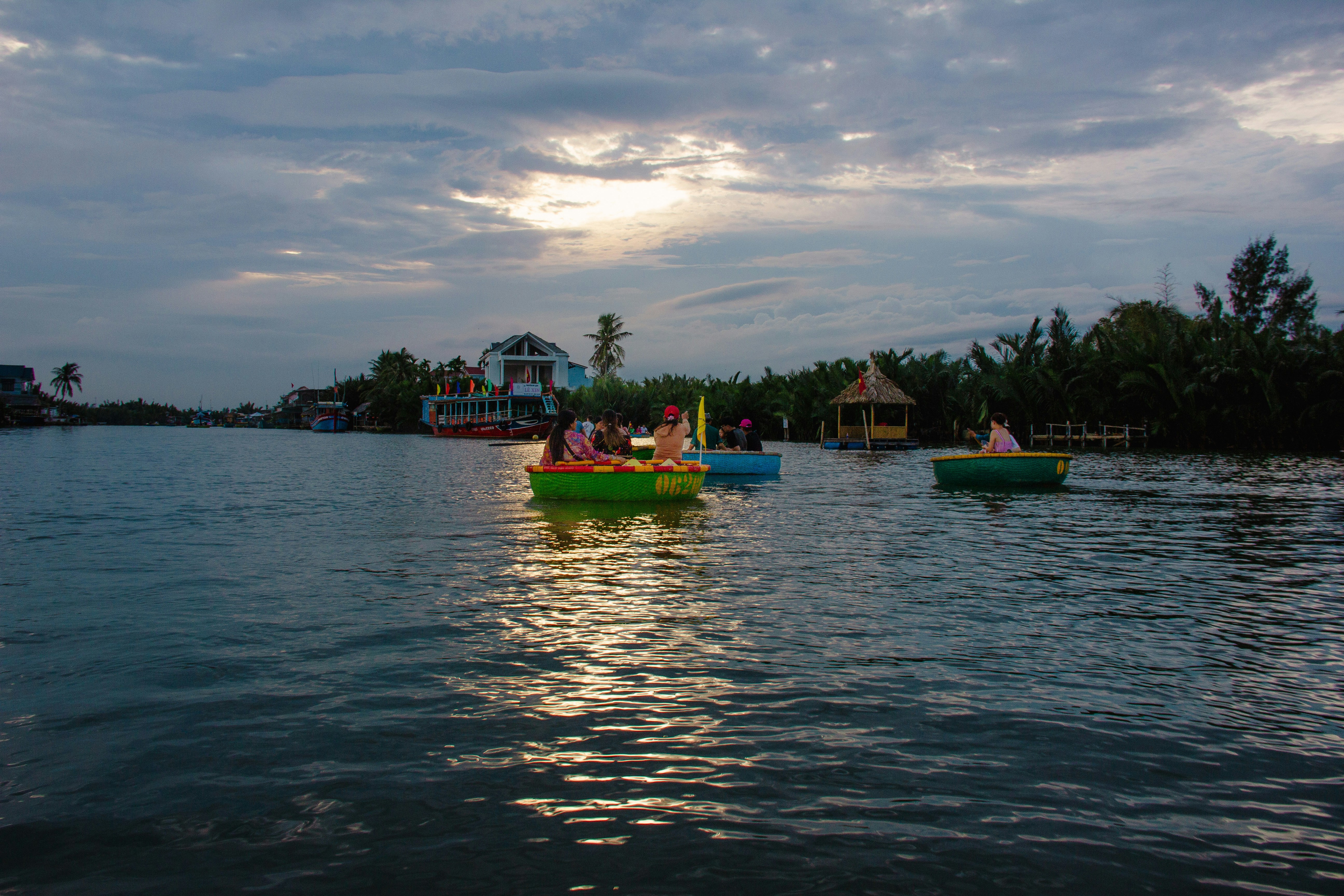 a group of small boats floating on top of a lake