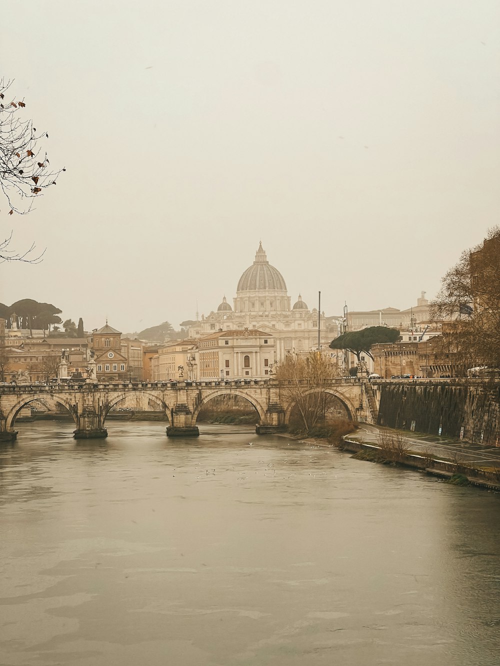 a river running through a city next to a bridge