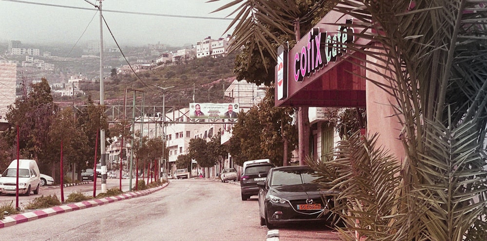 a street with cars parked on the side of it