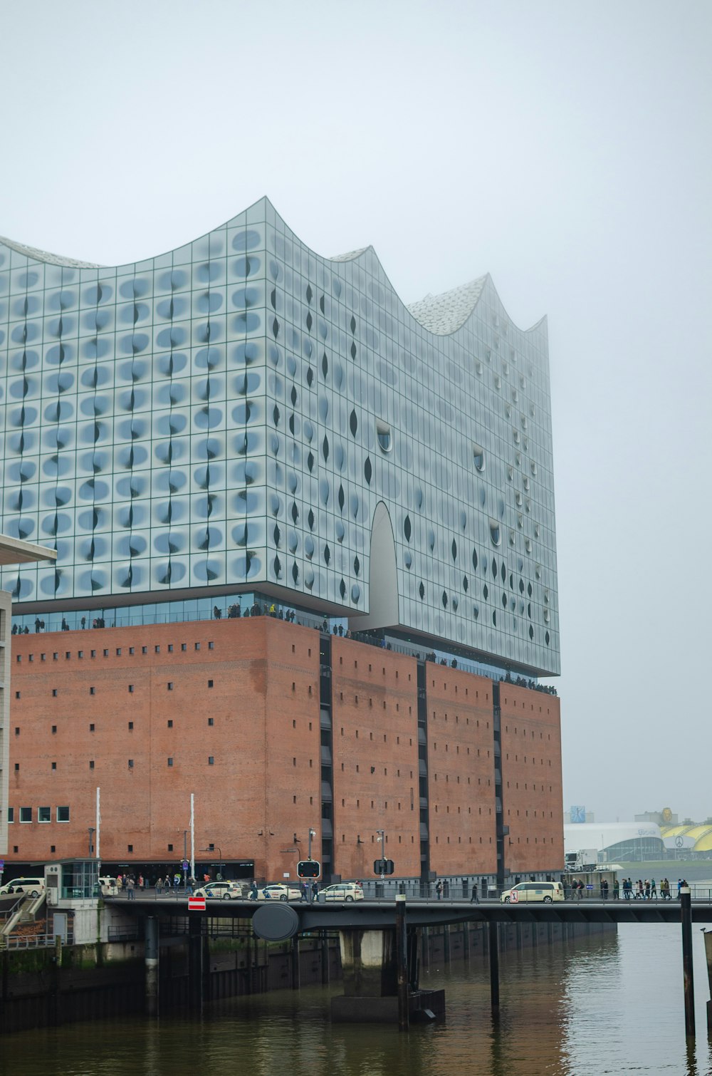 a large building sitting next to a body of water