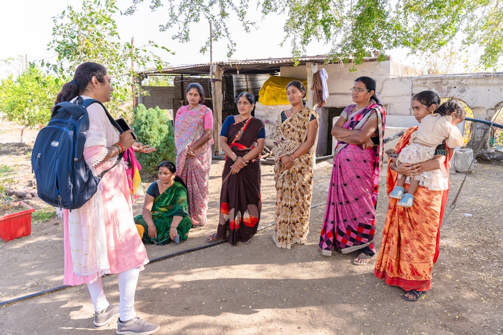 a group of women standing next to each other