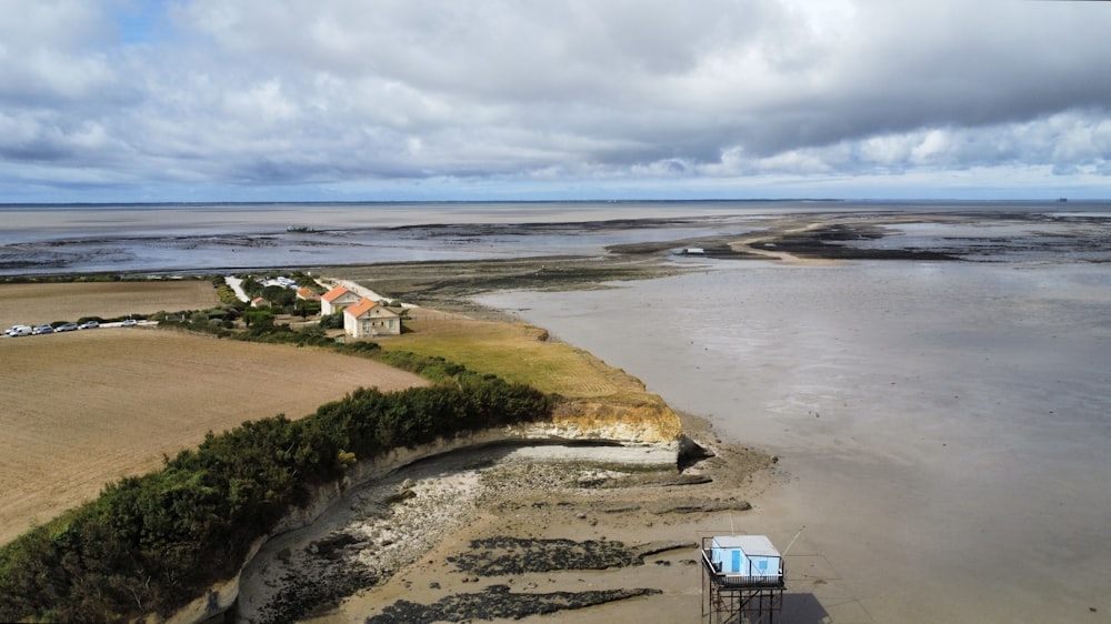 an aerial view of a house on a beach