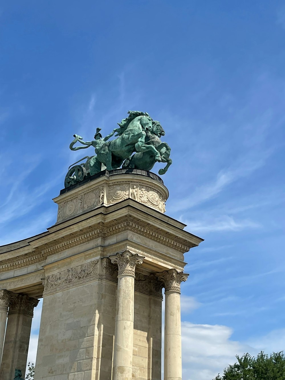 a statue of a horse and rider on a pedestal