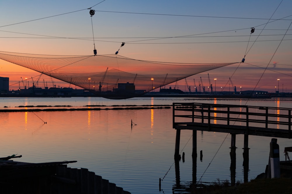 a fishing net hanging over a body of water