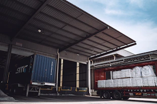 a semi truck is loaded with white bags