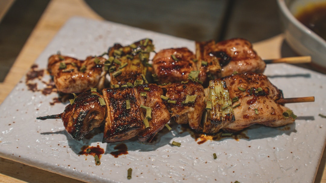 a white plate topped with meat and veggies,