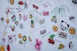 a wall covered in lots of different types of stickers