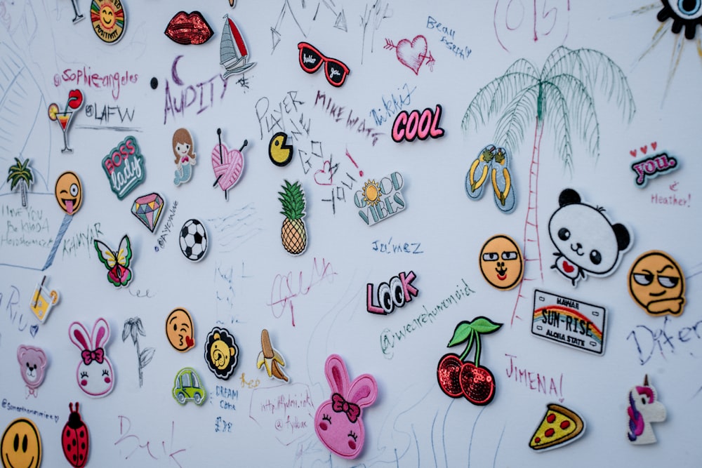 a wall covered in lots of different types of stickers