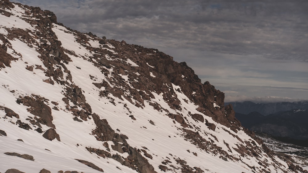 a man riding skis down a snow covered slope